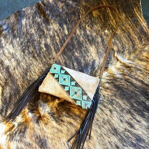 Handmade western leather and fringe purse.